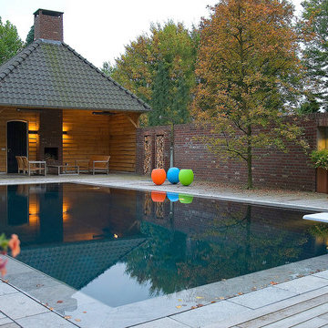 Lush garden with infinity-pool and waterfeature