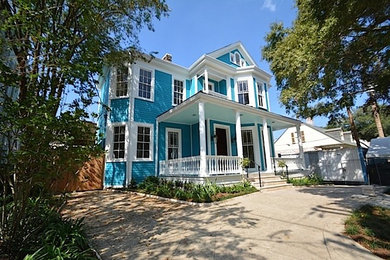 Inspiration for a mid-sized victorian blue two-story wood exterior home remodel in New Orleans
