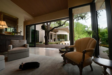 This is an example of a living room in Dallas with beige walls.