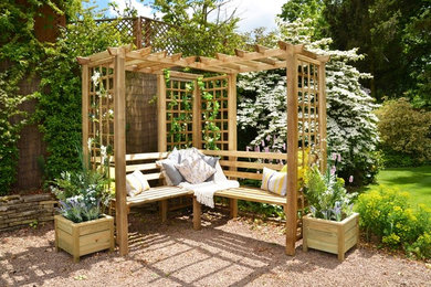 Inspiration for a timeless backyard gravel patio remodel in Vancouver with a pergola
