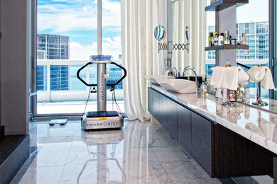 Inspiration for a large contemporary master marble floor and white floor bathroom remodel in Miami with flat-panel cabinets, black cabinets, gray walls, a vessel sink and marble countertops