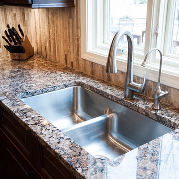 Traditional Kitchen with Granite Countertop, Stainless Steel Sink, Vertical Tile
