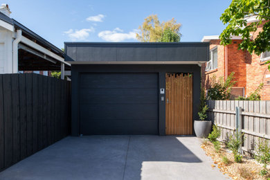 Inspiration for a small contemporary detached one-car garage in Hobart.
