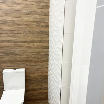 Master Bathroom with white textured and wood-patterned tiles