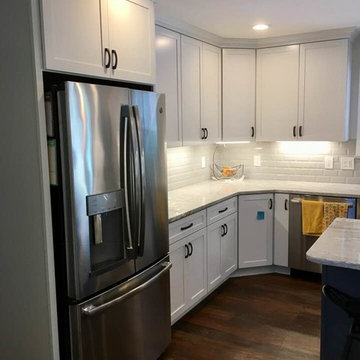 White Kitchen with Grey Marble counter-tops