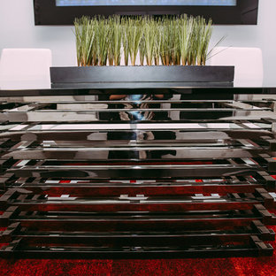 Inspiration for a large modern home office and library in Edmonton with grey walls, ceramic flooring and a hanging fireplace.