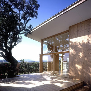 Großer, Überdachter Asiatischer Patio im Innenhof mit Dielen in Sonstige