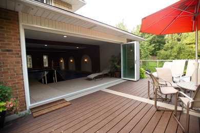 Inspiration for a mid-sized contemporary backyard pool remodel in Toronto