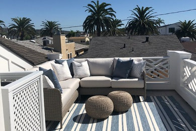 Small beach style front yard tile patio photo in Orange County with no cover