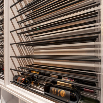 Custom Wine Cellar Features Modern Metal Racks with RGB Lights