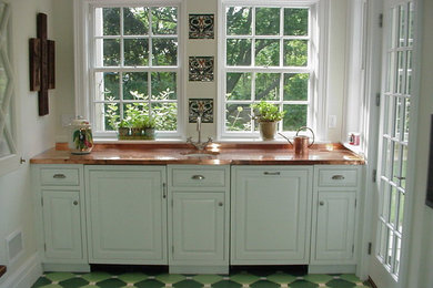 Example of a mid-sized classic single-wall ceramic tile wet bar design in Other with an undermount sink, raised-panel cabinets, white cabinets and copper countertops