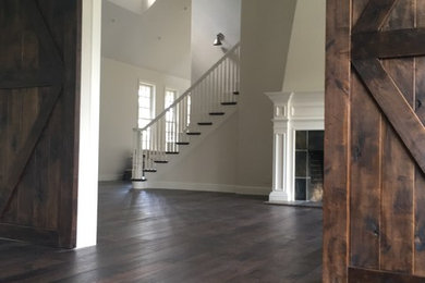 Living room - large craftsman open concept medium tone wood floor living room idea in Other