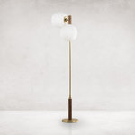 Four Hands - Colome Floor Lamp-Natural Walnut - A midcentury-inspired floor lamp made of aged brass with natural walnut detailing above and below, and two rotating frosted glass globes.
