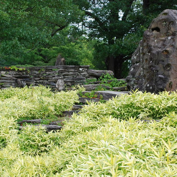 Boulder counterbalancing stone wall