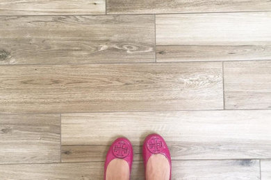 Example of an arts and crafts porcelain tile hallway design in Houston