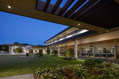 Large contemporary exterior in Miami with a flat roof.