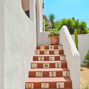Design ideas for a straight staircase in Los Angeles with terracotta treads and terracotta risers.