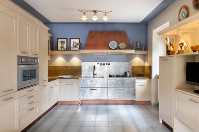 Inspiration for a traditional l-shaped kitchen with no island.