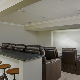 Inspiration for a medium sized classic open plan home cinema in Huntington with grey walls, carpet, a projector screen and beige floors.