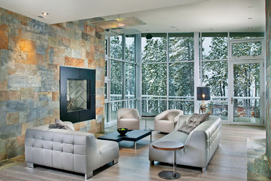 Design ideas for an expansive contemporary formal open concept living room in Atlanta with a stone fireplace surround, grey walls, a standard fireplace, light hardwood floors, no tv and grey floor.