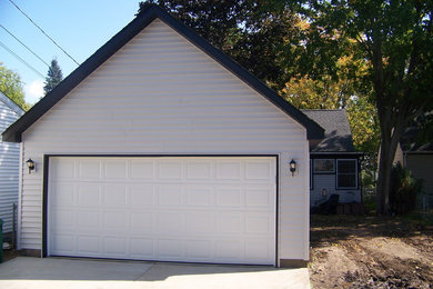 Design ideas for a mid-sized traditional detached two-car garage in Minneapolis.