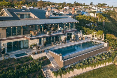 Example of a beach style home design design in Orange County