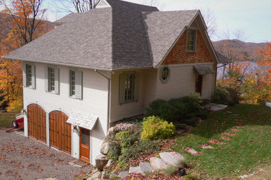 Mid-sized traditional gray two-story wood exterior home idea in Montreal with a hip roof