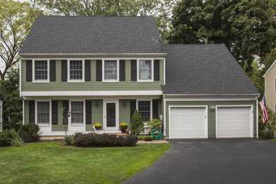 Example of a classic green exterior home design in New York