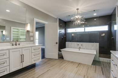 Example of a transitional master glass tile travertine floor bathroom design in Dallas with an undermount sink, white walls and marble countertops