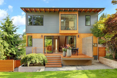 Trendy three-story wood house exterior photo in Seattle