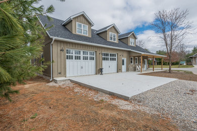 Inspiration for a mid-sized craftsman detached three-car garage workshop remodel in Other