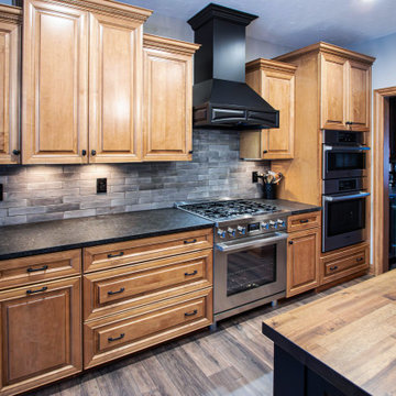 Reconfigured kitchen with new islands, countertops, backsplash