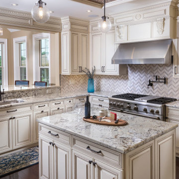 Traditional Kitchen cabinetry and island with granite top and chevron marble bac