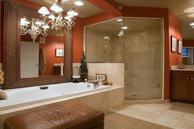 Large elegant master beige tile beige floor bathroom photo in San Francisco with shaker cabinets, medium tone wood cabinets, red walls and a hinged shower door