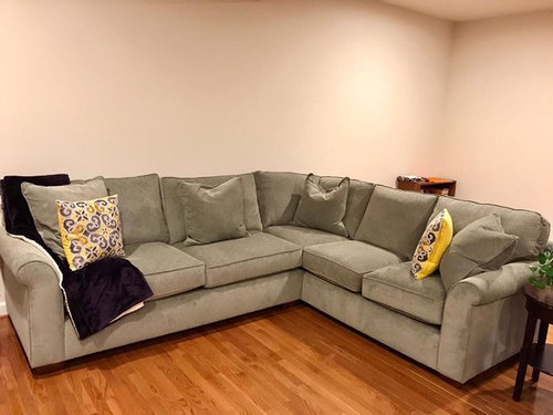 I need help choosing area rug to go under this sofa in living room.