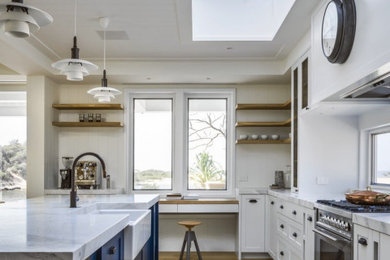 This is an example of a beach style kitchen in Central Coast.