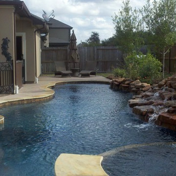 Freeform Flagstone Pool with waterfall, table & spa