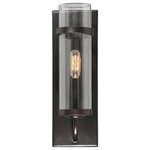 Savoy House - 1 Light Wall Sconce - This wall sconce has sleek, casual style with a touch of an industrial-inspired aesthetic. A tall, rectangular wall plate supports one curved light arm that holds a metal candle cover. This frame has a solid, understated practicality and a rich, dark, English bronze finish. The light arm holds a slim, cylindrical shade made of pristine, clear glass, allowing one 60W, C-style bulb to illuminate the area. Using a visible filament or Edison bulb will add to the vintage, utilitarian appeal. The sconce measures 5� wide, 14� high, and extends 6� from the wall �a superb size to put comfortable, industrial chic style along the walls of your dining room, kitchen, living room, entryway, family room, office, bedroom, hallway, or great room.