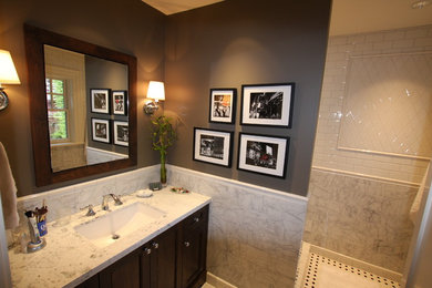 This is an example of a traditional bathroom in Vancouver with an undermount sink, shaker cabinets, dark wood cabinets, an open shower, stone tile and ceramic floors.