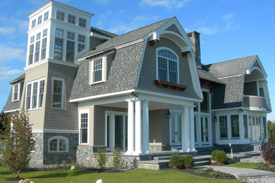 Large coastal gray two-story wood exterior home idea in Portland Maine