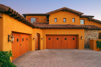 Example of a large southwest attached four-car carport design in Phoenix