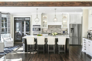 Large transitional dark wood floor eat-in kitchen photo in Atlanta with an undermount sink, shaker cabinets, white cabinets, quartz countertops, gray backsplash, stone tile backsplash, stainless steel appliances and an island