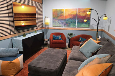 Inspiration for a mid-sized modern enclosed wall paneling family room remodel in Other with blue walls and a wall-mounted tv