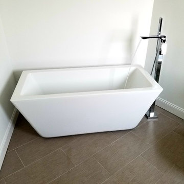 Stand alone bath tub with chrome filler