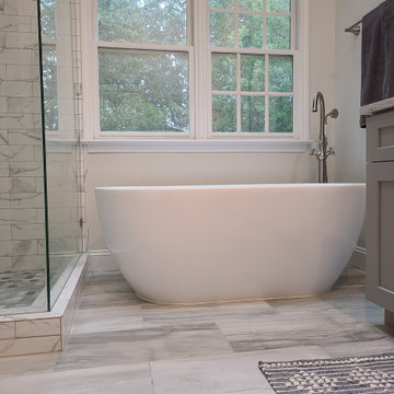 Freestanding Soaking Tub With Natural Light and Soft Finishes