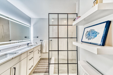Example of a mid-sized trendy master ceramic tile, beige floor and double-sink bathroom design in DC Metro with flat-panel cabinets, white cabinets, an undermount sink, quartzite countertops, white countertops and a built-in vanity