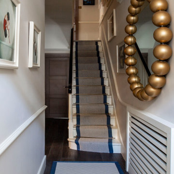 Hallway and stairs with stair runner in Chelsea, London
