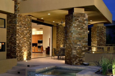 Example of a trendy brown two-story brick exterior home design in Phoenix