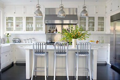 Design ideas for a traditional u-shaped kitchen in San Francisco with glass-front cabinets and white cabinets.