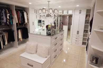 Large walk-in closet photo in Tampa with shaker cabinets and white cabinets